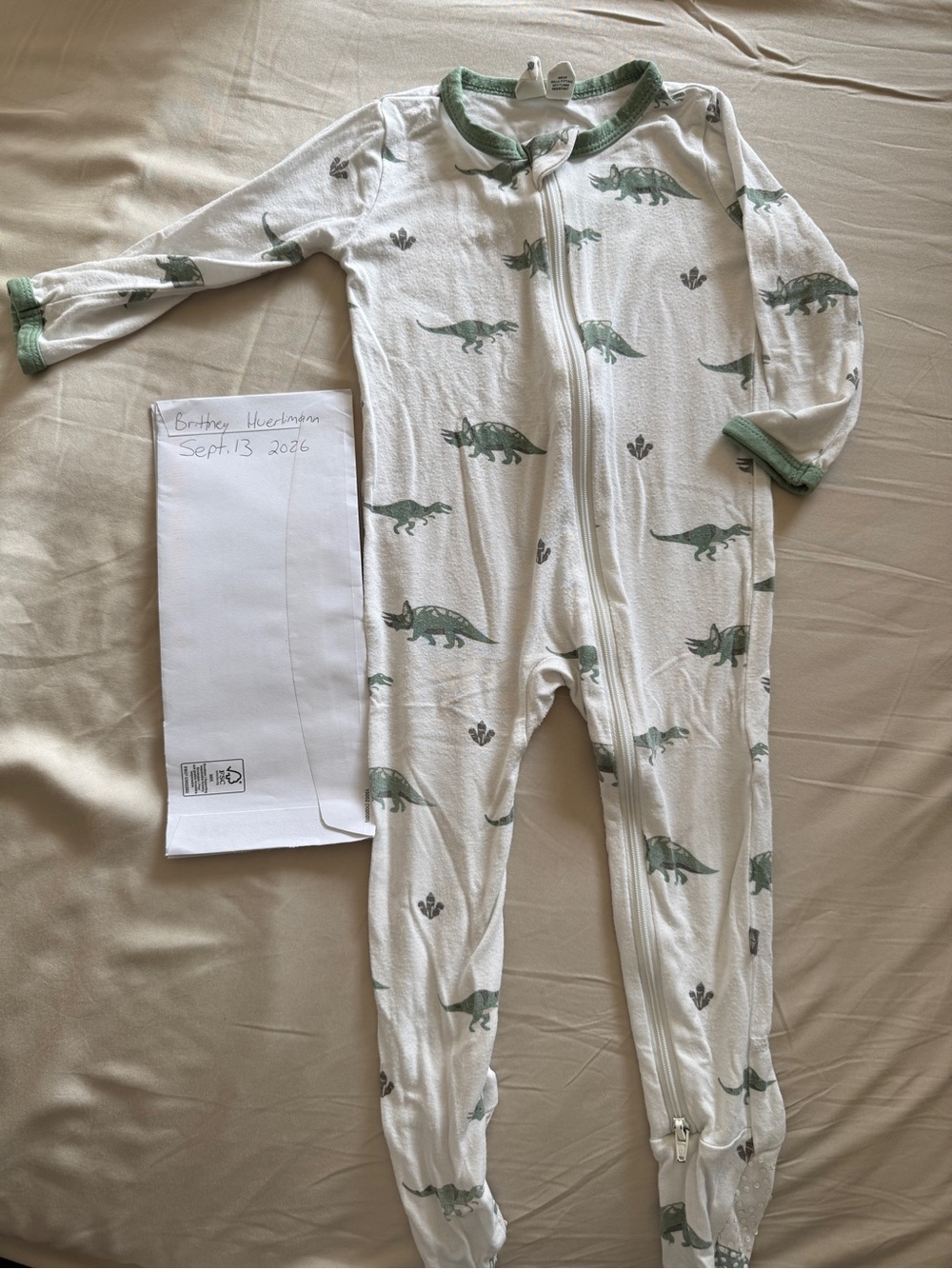 Kyte BABY White One-Piece Footed Pajamas with Green Dinosaur Print